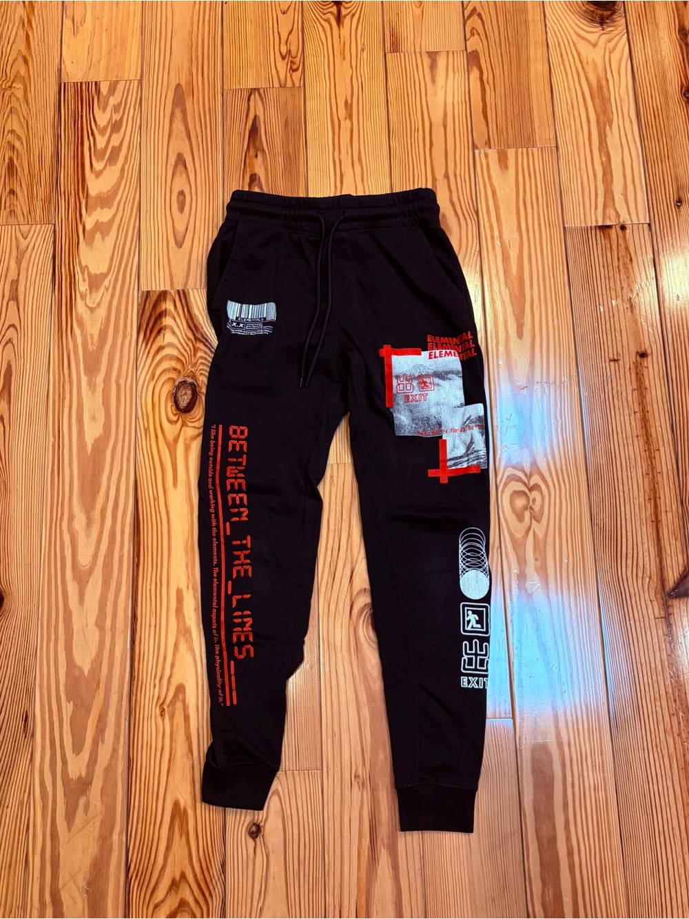TAG Elemental Black Joggers with Red & White Graphic Details